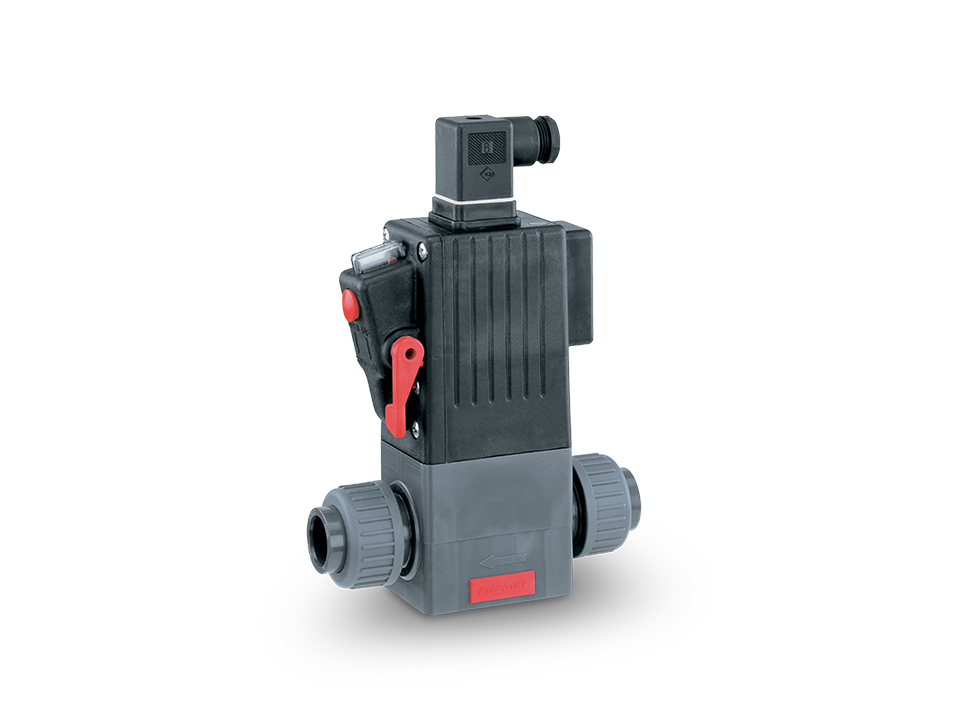Compact electrically operated solenoid valve with gray pipe connections, red hand lever, and standard plug – for precise control of media in automated processes.
