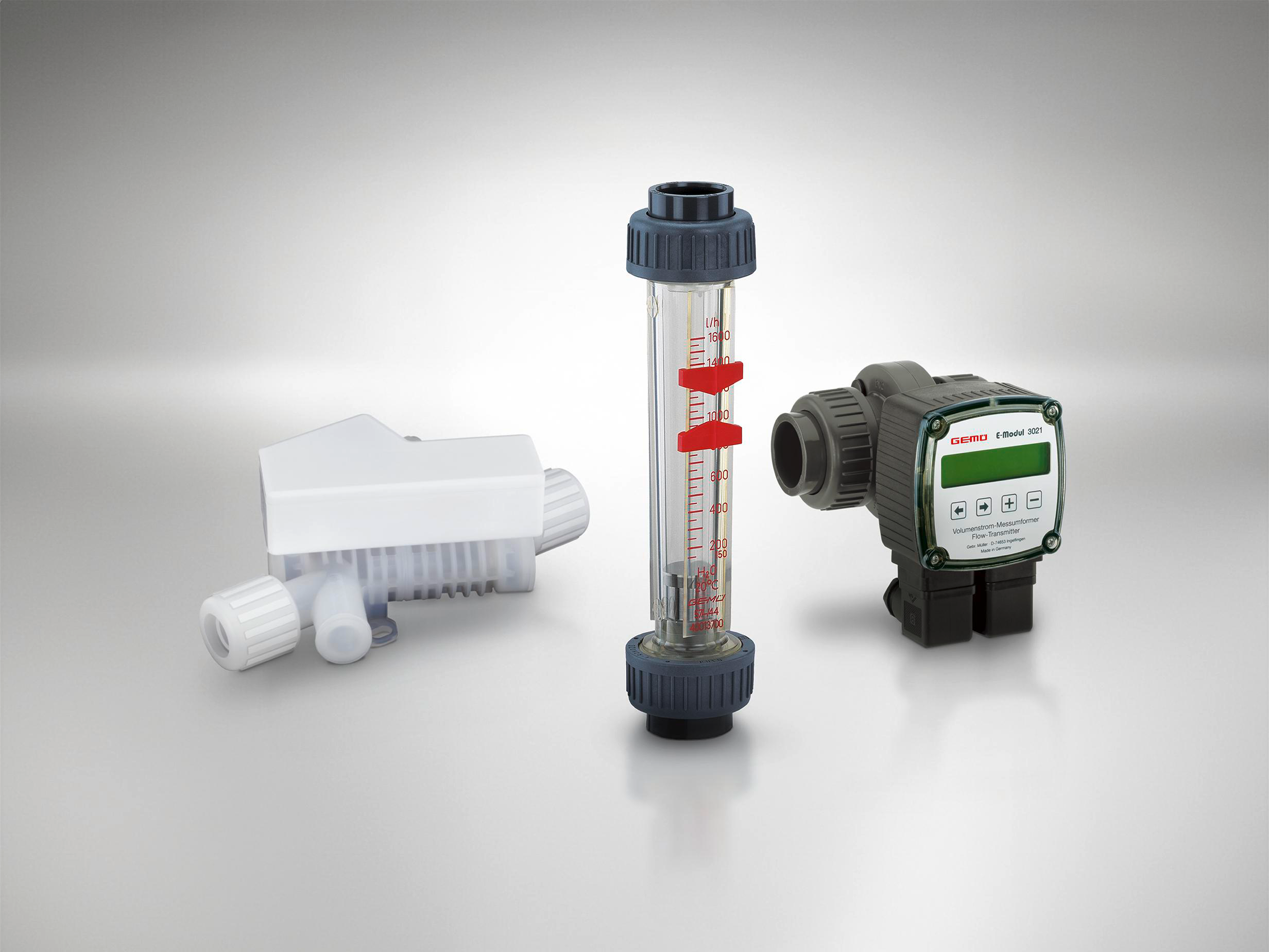 Three GEMÜ flow measuring devices, including sensor technology and sight glass solutions.